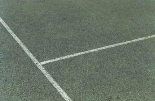 Macadam tennis court prior to cleaning.